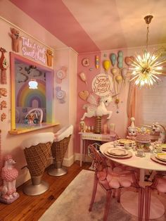 a room with pink walls and lots of decorations