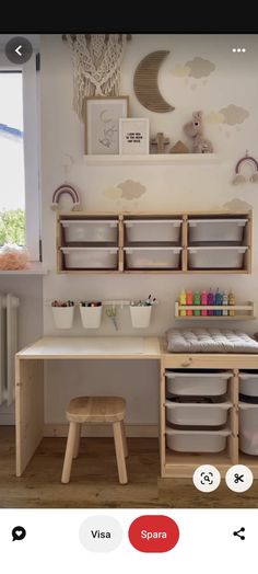 a child's play room with toys on the table and storage bins below