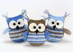 three crocheted owls sitting next to each other