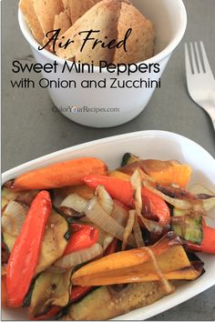 an air fried sweet mini peppers with onion and zucchini in a white bowl