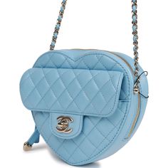 This CC In Love Large Heart bag is in blue lambskin leather with light gold tone hardware and features a front flap with signature CC turnlock closure, half moon back pocket, zip top closure and an interwoven light gold tone chain link and blue leather shoulder strap. The interior is lined in blue leather and canvas with two open slip pockets on each wall. Collection: 22S Origin: France Condition: Pristine, new or never (plastic on hardware) Accompanied by: Chanel box, Chanel dustbag, carebook and felt Measurements: 8" width x 7" height x 2.5" depth; 20" strap drop Chanel Box, Leather And Canvas, Large Heart, Heart Bag, Marthas Vineyard, Coastal Cottage, Blue Bags, Zip Top, Lambskin Leather