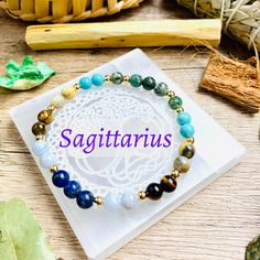 ✨Listing is for 1 Sagittarius Zodiac Crystal Beaded Bracelet. Each bracelet comes with a short summary of the crystals included. ♐Sagittarius (November 22 - December 21) ♐Gemstone Beads are 6mm. 14K gold plated beads are 4mm. ♐Size: Elastic bracelet, 1 size fits most. Fits most women wrist size 6 - 7 inches. Bracelets are stretchable and very comfortable to wear daily. ♐Each bracelet is designed with 6 different crystals that resonates with the traits of Sagittarius or enhances the energies that Crystal Zodiac, Glow Crafts, Sagittarius Gifts, Different Crystals, Sagittarius Zodiac, 22 December, African Turquoise, Birthstone Bracelet, Zodiac Gifts