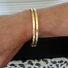 Double row hammered cuff bracelet. An everyday essential! Great alone or layered.  Details: 1) Cuff is 10mm wide at it's widest point, tapering off to 7mm at the ends.  2) 14k gold plated Sterling Silver. 3) Adjustable - will fit 6" to 8" wrists. Hammered Cuff Bracelet, Gold Cuff Bracelet, 3 R, Gold Bracelet Cuff, Gold Cuffs, Gold Plated Sterling Silver, Sterling Silber, Arm Band, Cuff Bracelet