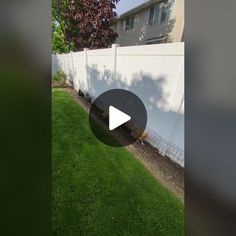 an image of a backyard with grass and fence