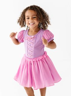 Introducing the Frying Pan Dress – a fairytale dream come true! This adorable dress is fit for a princess, with puff sleeves, delicate eyelet lace trim, and a crisscross on the bodice. Made with a soft cotton bodice and chiffon and tulle skirt, it's perfect for twirling, playing pretend, and feeling like a magical prin Magical Princess, Enchanting Dress, Eyelet Lace, Frying Pan, A Princess, Kid Tees, Comfy Fits, Frying, Dream Come True