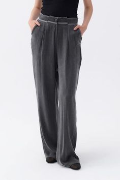 Designed with a chic and flattering silhouette, these pants are crafted from superior-quality fabric to withstand your busy lifestyle. Transitioning seamlessly from day to evening, they are an ideal selection. They feature a high waist, zippered and metal button closure, wide legs, pockets, and pleated palazzo style. Dry clean Material:56% Lyocell, 44% Viscose High rise Officially licensed Imported Brand: Nocturne Model Product Size: S Model Size: Height 5'10 / Bust 29.5 in / Waist 23 in / Hips Elegant Dress Pants With Elastic Waistband, Elegant Trousers With Elastic Waistband, Elegant Elastic Waistband Bottoms For Business Casual, Elegant Business Casual Bottoms With Elastic Waistband, Elegant Solid Wide Leg Pants With Pockets, Elegant Straight Leg Dress Pants With Elastic Waistband, Elegant Ankle-length Dress Pants With Elastic Waistband, Elegant Pants With Elastic Waistband, Sleek Bottoms With Elastic Waistband And Straight Pants