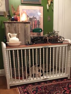 an old radiator in the corner of a room with green walls and rug