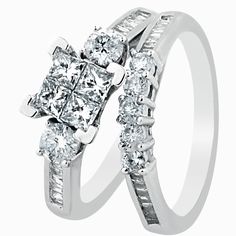 two white gold wedding rings with diamonds on each side and one diamond in the middle