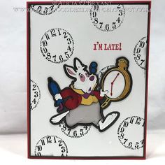 a card with an image of a rabbit holding a clock and the words i'm late on it