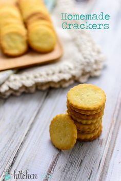 homemade crackers stacked on top of each other next to a cutting board and napkin