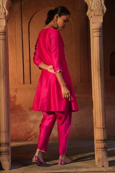 Fuchsia pink three fourth sleeves short kalidar dori tie-up kurta with scallop fleur embroidery on the neck and princessline using beads, cut dana, sequins highlights. Paired with a trim gota patti embellished tulip pant. - Aza Fashions Elegant Hand Embellished Pink Traditional Wear, Elegant Pink Hand Embellished Traditional Wear, Pink Silk Hand-embellished Sets, Hand Embellished Pink Silk Set, Pink Hand Embellished Silk Set, Pink Hand Embellished Sharara For Diwali, Elegant Embellished Pink Kurta, Elegant Pink Embellished Kurta, Festive Embellished Pink Kurta