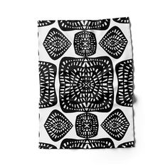 a black and white pattern on a square piece of paper that looks like an intricate design