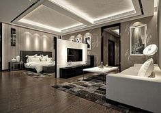 a modern living room with wood floors and white furniture in the center is lit by recessed lighting