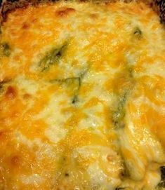 a casserole dish with cheese and broccoli on it in a pan