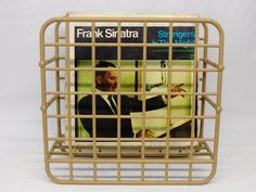 a magazine rack that has a man in a suit on it