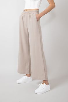 These Thermal Wide Leg Pants for Women in Taupe feature an elastic waistband, wide leg silhouette, and thermal, lightweight material for comfort all day. These pants are perfect for lounging around or going out on the town! Features: Final Touch Style: P70169B-TAUPEII Color: Taupe 85% Polyester 10% Rayon, 5% Spandex Women’s pants Thermal, lightweight material Relaxed fit Side pockets Wide leg Elasticated waistband Good stretch Unlined Measurements from size small: Waist: 27” Inseam: 27” Hand was Versatile Wide Leg Pull-on Pants For Loungewear, Ankle-length Pull-on Pants For Loungewear, Solid Wide Leg Pants For Leisure, Comfortable Ankle-length Loungewear Pants, Leisure Wide Leg Trousers, Comfortable Ankle-length Lounge Pants, Solid Color Wide-leg Leisure Pants, Leisure Wide-leg Pants, Comfortable Wide Leg Pants For Fall