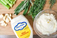 the ingredients to make blue plate mayonnaise are displayed on a wooden cutting board