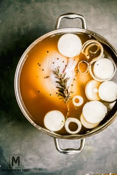 a pot filled with soup sitting on top of a table