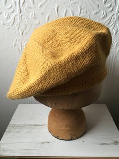 "This mustard knit beret is made from gorgeously soft alpaca, meaning it is soft and cosy but still light and comfortable. I've knitted a classic Scottish tam style, with softly rolled brim so that it's easy to put on and can be folded up and kept in your pocket for chilly days.  Equally great for men or women, this hat is sized to fit the average head, coming up at 22.5\" (57cm) circumference / 11\" diameter. If you need slightly bigger or smaller please let me know and I'll be happy to knit you a perfect fit. Matching gloves are available in my shop too, if you want the full cosy set! They also make a really lovely gift. All my pieces are made by my in my little north Devon studio." Yellow Beret, Dapper Gentleman Style, Knit Beret, Knitted Beret, Yellow Hat, Hat Men, Capsule Outfits, Sparkly Dress, Hat Knitting Patterns