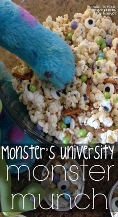 a bowl filled with monster eyes next to a blue stuffed animal and text reading monster's university monster munch