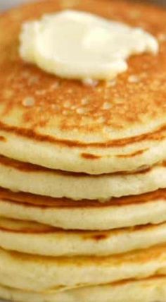 a stack of pancakes with butter on top