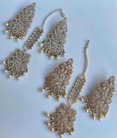 These gorgeous sets of tikka and jhumka come in 2 beautiful colors and are pastel tones to match any outfit. The multi set is a subtle mix of colors to create a uniform look and the champagne is the perfect single pop of color for any outfit! Comes as a set of earrings and headpiece (tikka) Bridal Earrings For Wedding And Eid, Elegant White Tikka For Eid, Elegant White Tikka For Celebration, Elegant Sets With Latkans For Celebration, Elegant Celebration Sets With Latkans, Elegant Chandbali Sets With Matching Earrings, Elegant Festive Tikka With Matching Earrings, Traditional Cream Jewelry For Wedding, Elegant Tikka For Celebration