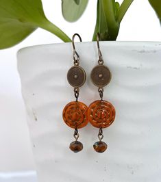 One of my favorite brass pieces are these textured circles - so fun to use with these vintage style orange Czech glass beads. Separating the elements gives the earrings more movement and these are a great length without being too long.  The metal I use is natural brass. It is nickel-free, lead-free compliant and made in the USA - Hooray! The total length is 2 inches from the top of the earwire.   Enjoy! Glass Beads Jewelry, Brass Earrings, Czech Glass Beads, Czech Glass, Clay Jewelry, Beautiful Jewelry, Glass Beads, Beaded Jewelry, Jewelry Earrings Dangle