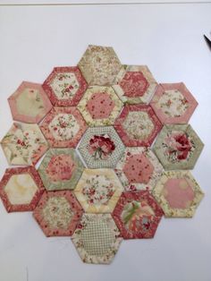 an arrangement of hexagons with flowers on them