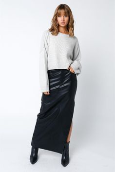 Unleash your inner fashion rebel in our Black Faux PU Leather Slit Maxi Skirt. This stunning piece features a sleek faux leather material that adds edge to any outfit. The daring slit adds a touch of sexiness, while the maxi length adds an air of sophistication. Perfect for a night out or a bold daytime look. Belt loops Front button and zipper closure Front and back pockets Front leg slit Faux PU leather material Leather Maxi Skirt, Midi Skirt Fall, Pu Skirt, Pu Fabric, Jumpsuit Shorts Rompers, Tiered Maxi Dress, Edgy Look, Striped Cardigan, Romper With Skirt