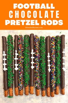 Overhead image of football pretzel sticks arranged in a horizontal line. Football Theme Dessert Table, Football Themed Pretzel Rods, Basketball Pretzel Rods, Football Food Ideas Desserts, Football Pretzel Rods, Fall Pretzel Rods, Football Pretzels, Football Dessert Ideas, Football Party Treats