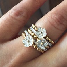 This floral-inspired ring stack is beyond dreamy. #Estenza #ring #rings #stack #stacks #stacked #ringstack #showmeyourstack #layer #layered #layers #gold  #diamond #diamonds #special #estenza #jewels #jewelry #finejewelry #jewelrygram #love #and #beauty #beautiful #futureheirloom #diamond #diamonds #stacksarethenewblack #floral #flower Luxury Stackable Fine Jewelry Rings, Luxury Timeless Stackable Diamond Ring, Luxury Gold Diamond Stackable Rings, Fine Jewelry Sparkling Diamond Stackable Rings, Luxury Gold Multi-stone Stackable Rings, Cowrie Shell Jewelry, Antique Silver Jewelry, Diamond Necklace Designs, Jewelry Illustration