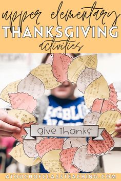 a person holding up a wreath made out of paper with the words give thanks written on it