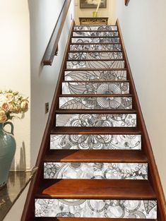 the stairs are decorated with decorative glass panels