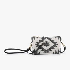 Adjustable/detachable crossbody strap Detachable wristlet strap Inner cardholders Inner zip pocket Dimensions: 8.75"L x 5.25"H x 1"D Christmas List, Zip Pockets, Card Holder, Black