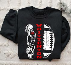 a black shirt with an image of a football player and the words washington on it