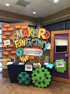 a table with an assortment of crafts and decorations on it that says maker fun factory