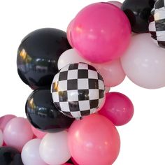 black, white and pink balloons are arranged in the shape of a checkerboard ballon