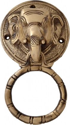 an elephant's head is mounted on the handle of a door knocker,