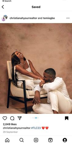 a man and woman sitting on a chair with their arms around each other