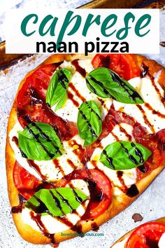 a pizza topped with mozzarella, tomatoes and basil