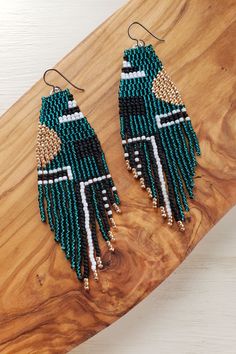 Unique hand woven seed bead earrings. Geometric modern design, 2-drop brick stitch and fringe lightweight glass bead long dangling drop earrings. Deep teal, rose gold with black and white accents. Seed Bead Brick Stitch, Bead Brick Stitch, Beaded Fringe Earrings, Earrings Geometric, Jewelry Design Earrings, Handmade Wire Jewelry