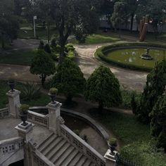 an aerial view of a park with stairs and fountains