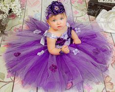 "PLEASE NOTE THAT THIS LISTING IS FOR THE TUTU, TOP, HEADBAND AND BRACELET ONLY. THE WINGS AND BAREFOOT SANDALS ARE NOT INCLUDED BUT ARE AVAILABLE FOR PURCHASE IN MY SHOP. A gorgeous and unique long tutu, top, and headband set in a glorious ultra violet and purple. Includes 1. A gorgeous high quality lavender and purple long ankle length tutu with different shimmer and glitter tulle (the glitter tulle does shed some glitter. If you prefer no glitter tulle, please let me know in the notes and I w Toddler Wedding Dress, Lilac Flower Girl Dresses, Baby Special Occasion Dress, Outfits Purple, Purple Flower Girls, Butterfly Fairy Wings, Fabric Flower Headbands, Birthday Tutu Dress