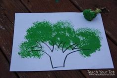 a piece of paper with a drawing of a tree and broccoli on it