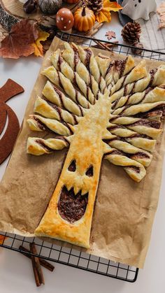 a tree made out of pastry sitting on top of a table next to other items