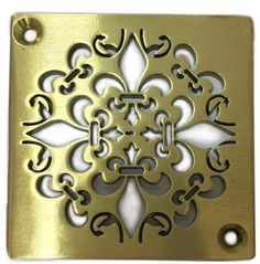 an ornate design is shown on the side of a brass plate with white and black accents