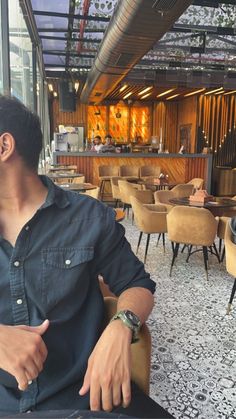 a man sitting at a table in a restaurant