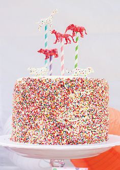 a birthday cake with sprinkles and candles