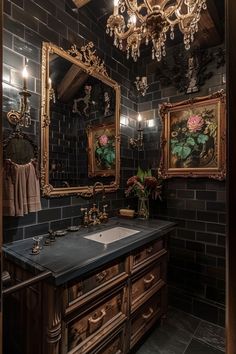 a bathroom with two mirrors and a sink under a chandelier hanging from the ceiling