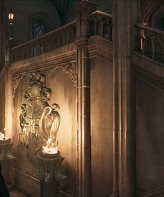 a man standing in front of a large clock on a wall next to a stair case